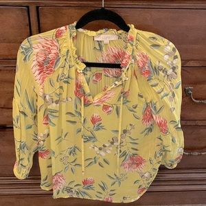 Yellow Georgette too with 3/4 sleeves and a ruffled neck with neck ties